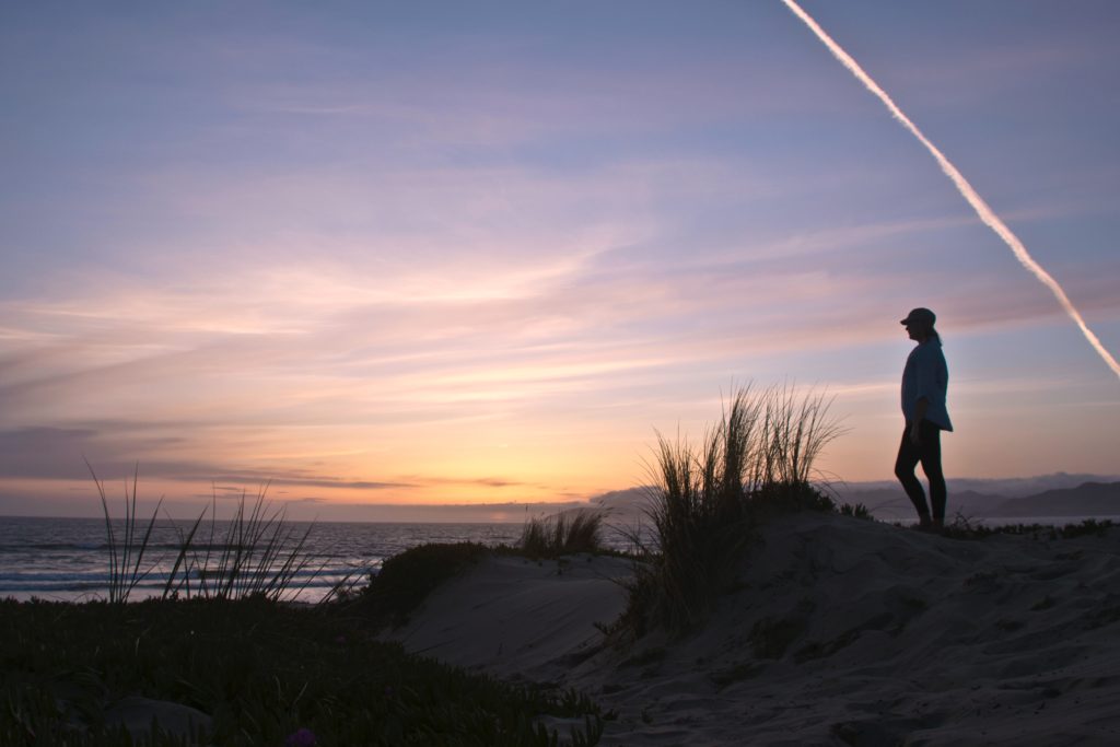 Woman observes a sunrise